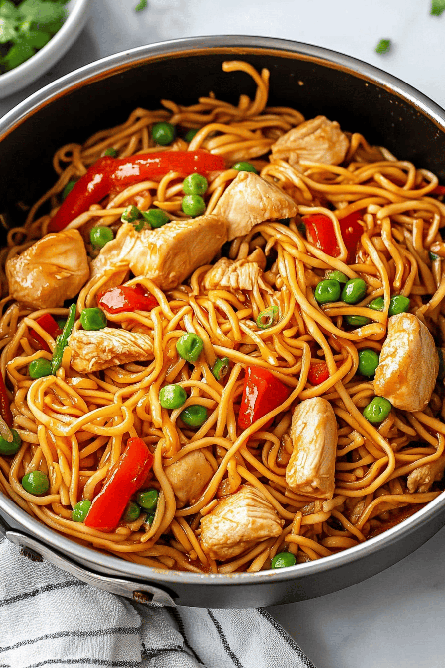 Chicken Lo Mein Recipe ingredients organized and measured on kitchen counter