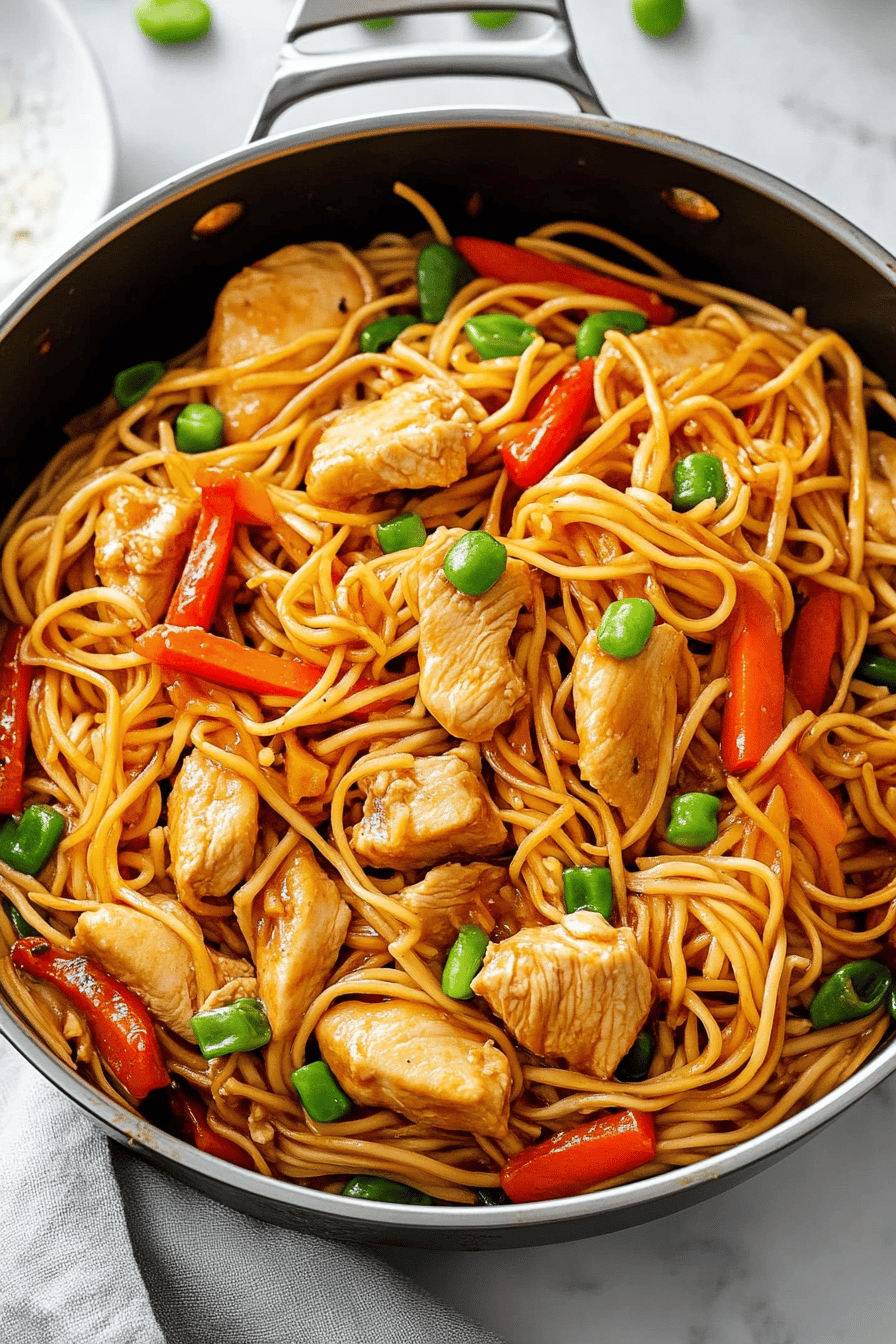Chicken Lo Mein Recipe slice on plate showing perfect texture and swirl pattern